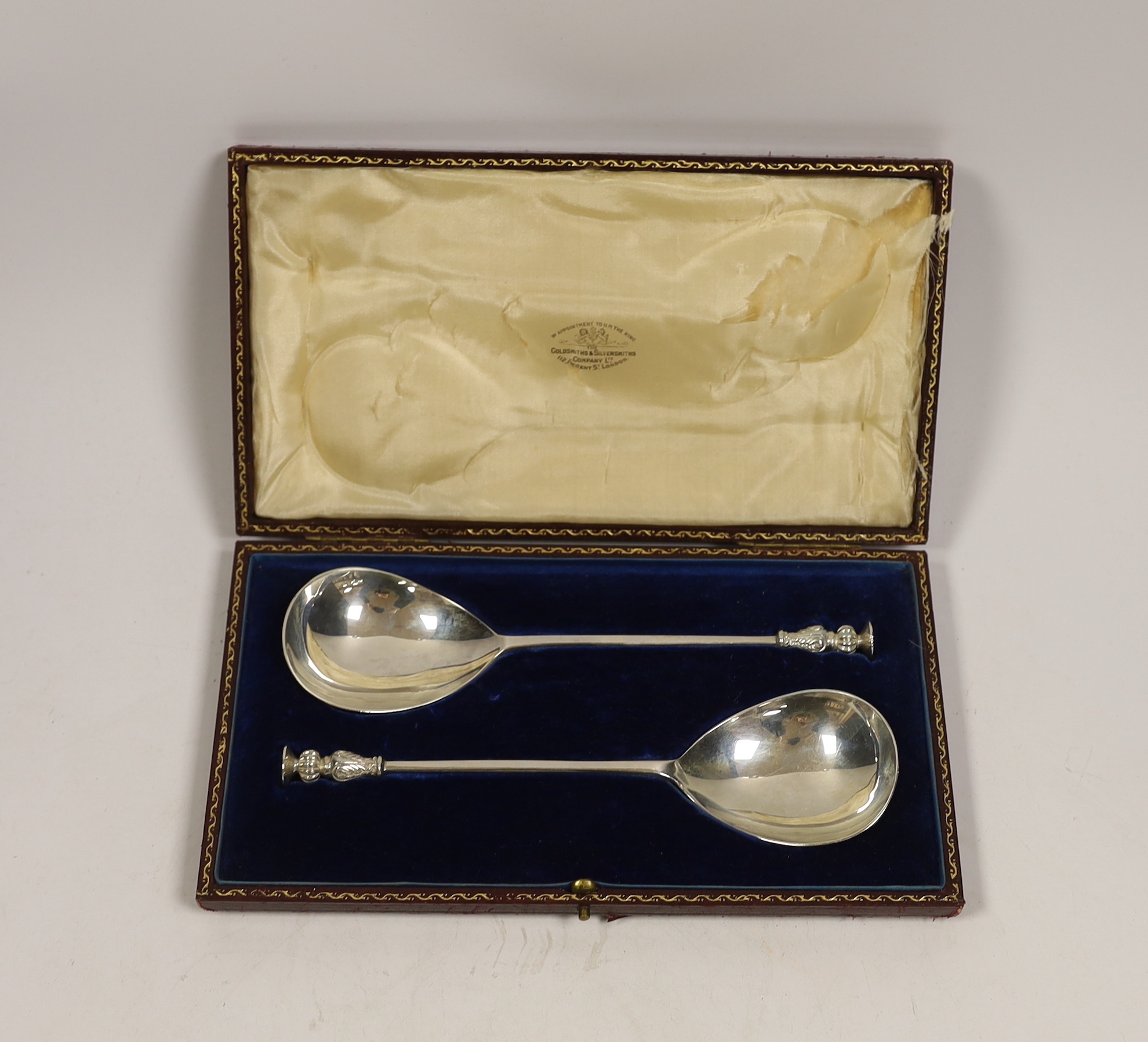 A cased pair of late Victorian silver seal top serving spoons, Goldsmiths & Silversmiths Co Ltd, London, 1893, 19.3cm, 4oz.